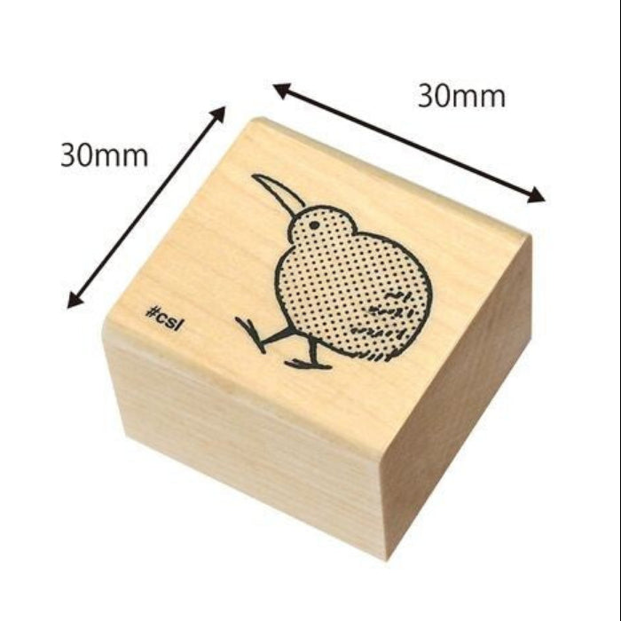 Wooden stamp with a kiwi bird design and measurements on a white background