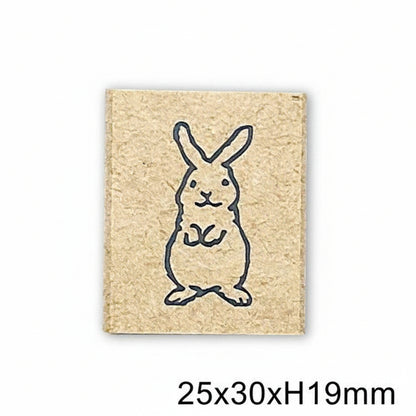 Rubber stamp with a rabbit design on a beige background