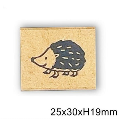Rubber stamp with a hedgehog design on a beige background