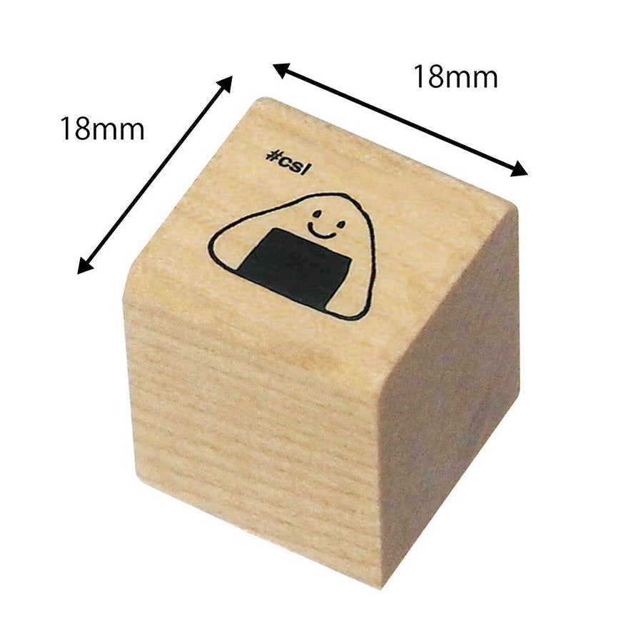 Wooden stamp with a smiley face onigiri design and dimensions labeled on a white background