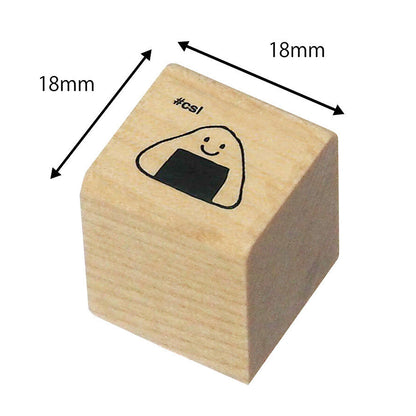 Wooden stamp with a smiley face onigiri design and dimensions labeled on a white background
