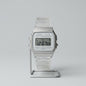 Silver Casio digital watch on a light gray background