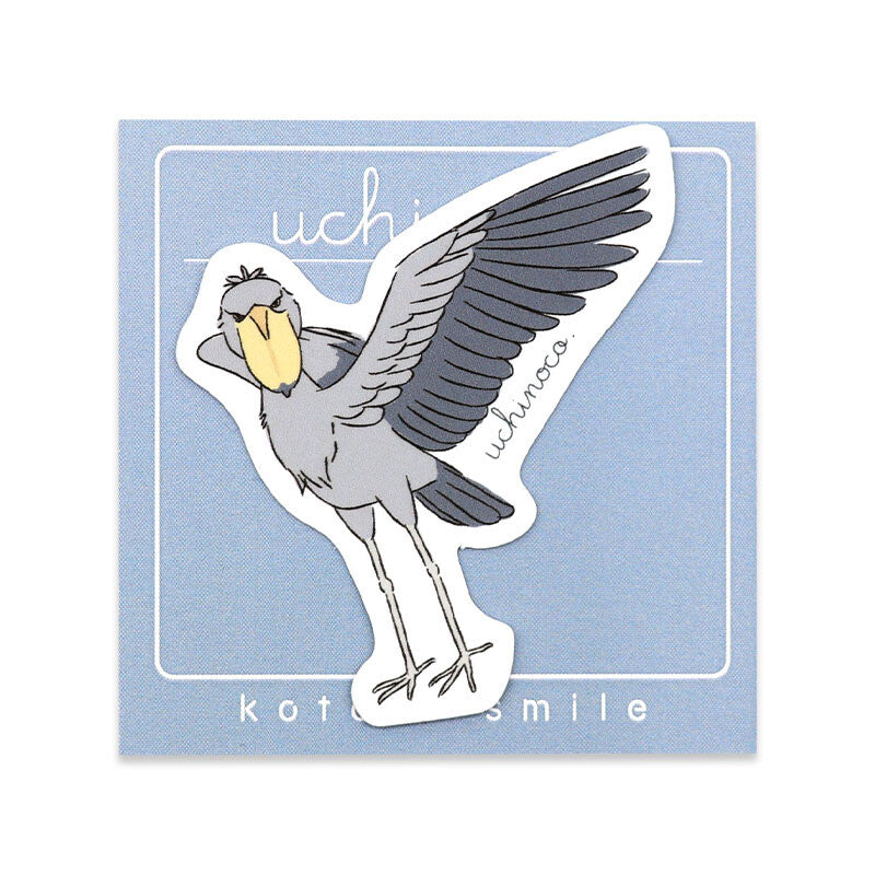 Sticker of a bird with open wings on a light blue background, featuring the brand 'uchiko'.
