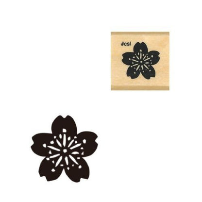 Rubber stamp with black cherry blossom design on a white background