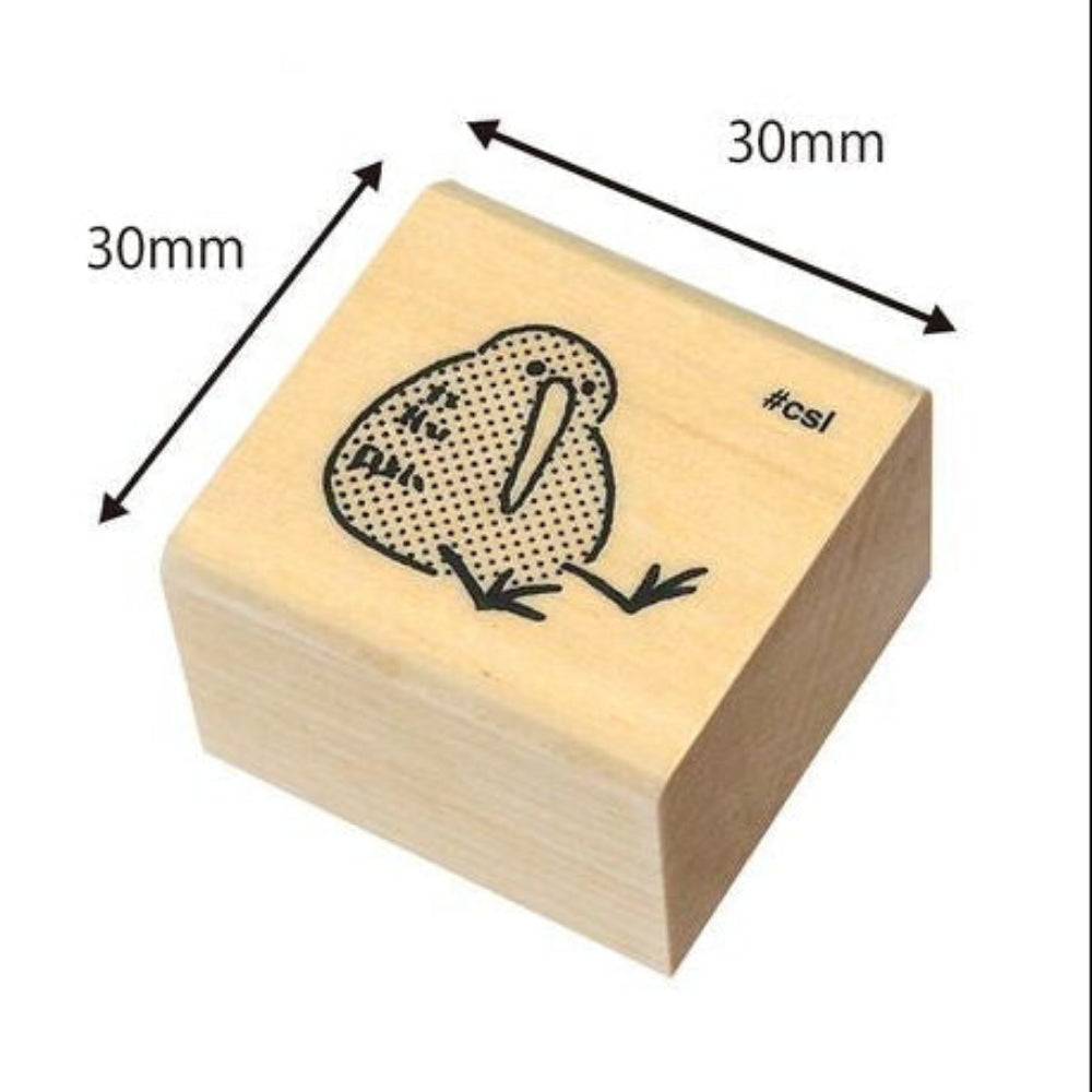 Wooden stamp block with a kiwi bird design and measurements on a white background