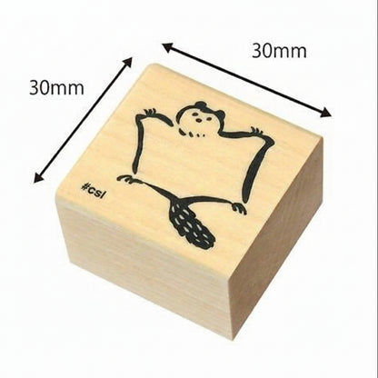 Wooden stamp with a design of a flying squirrel, dimensions indicated, on a white background.