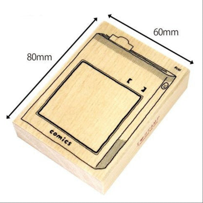 Wooden stamp block of a comic book with dimensions labeled on a white background