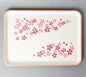 Rectangular tray with pink floral pattern on a gray background
