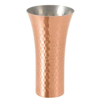 Copper tumbler with a silver interior on a white background