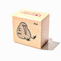 Wooden stamp block with a bird design on a white background