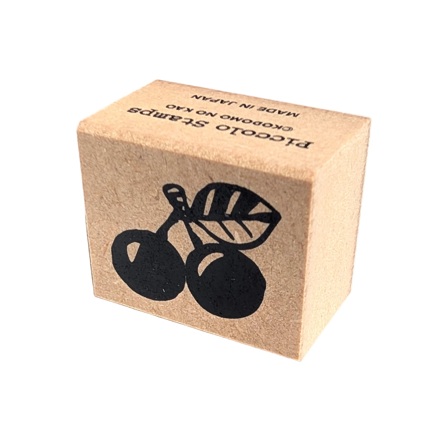 Kraft paper block with black cherry design and text on a white background