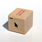 Wooden stamp with text and a black arrow on a white background