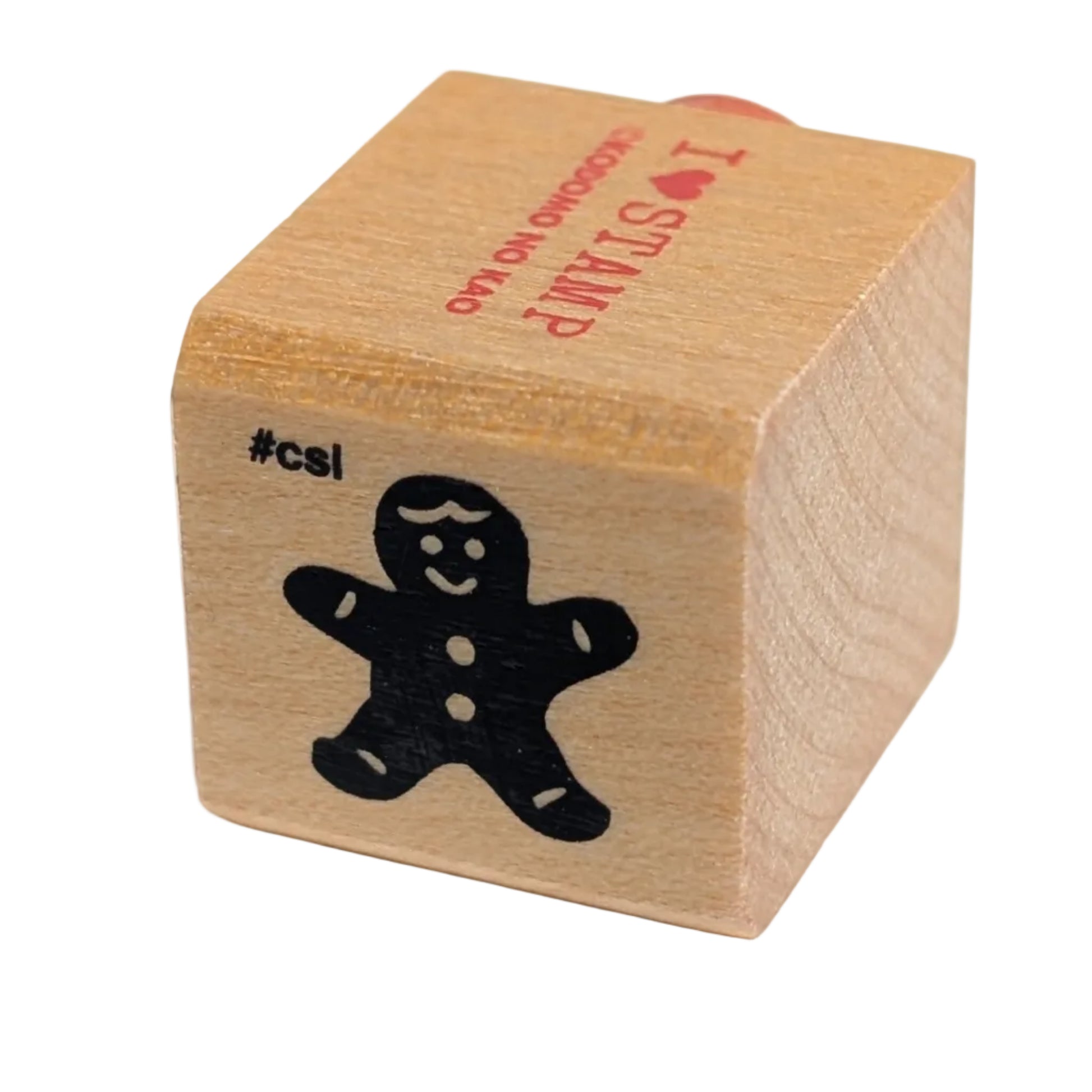 Wooden stamp with a black cutout of a gingerbread man on a white background