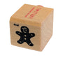 Wooden stamp with a black cutout of a gingerbread man on a white background